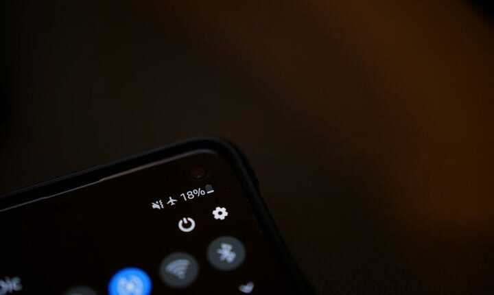 black remote control on white surface