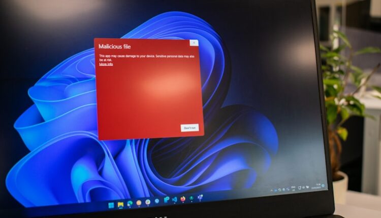 a dell laptop computer with a red screen